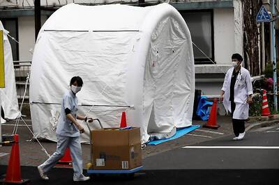 In Cash-loving Japan, Banks Still Busy Despite Coronavirus Emergency