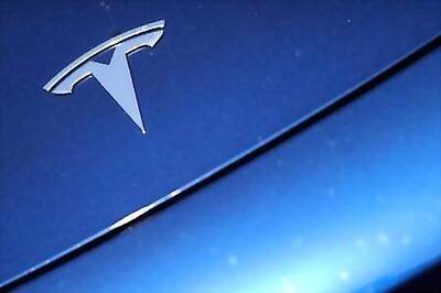 Tesla woos retail investors with stock split, shares rise