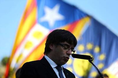 Sacked Catalonia Leader Puigdemont Turns Himself In, Polls Show Independence Strength