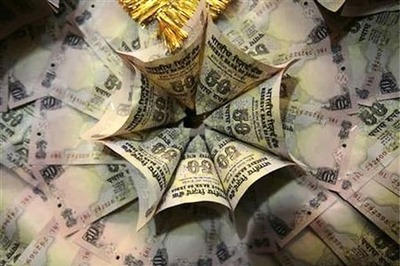 Rupee skids to 56 versus dollar; more falls seen