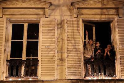 With Gothic Church Bells and Candles Lit in Windows, France Honours Its Covid-19 Victims