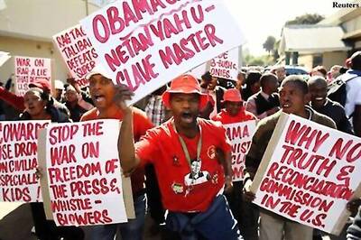 Obama protesters rally near hospital treating Mandela