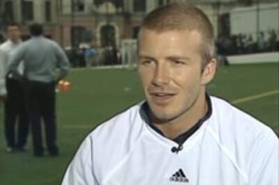 Beckham spotted ogling at sexy cheerleaders