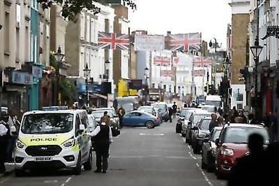 Lone Revellers Brighten Notting Hill's Empty Streets On Carnival Day