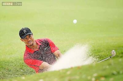 Tiger Woods's triple bogey leaves him tied for last
