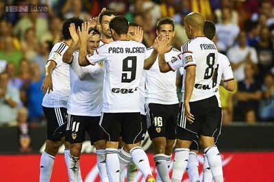 Valencia romp to 3-0 win over 10-man Malaga