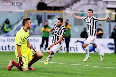 Juventus beat Livorno 2-0 to move top of Serie A