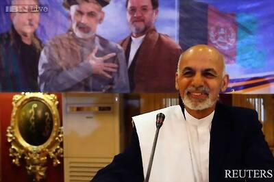 Historic, anxious handover as Afghanistan swears in new leader