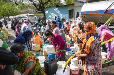 Delhi Water Crisis: Residents Chase Water Tankers with Buckets | Video