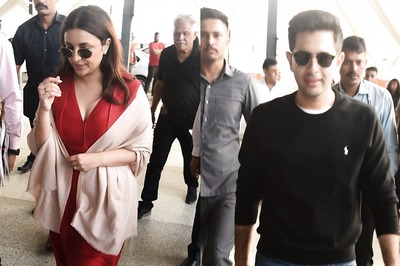 Parineeti Flaunts Bridal Glow In Red; Raghav Chadha Greets Paps As They Head To Udaipur for Wedding