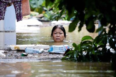 Flash Floods, Landslides Kill 12, Destroy Villages in Central Vietnam