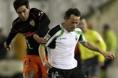 Racing and Valencia draw in bad-tempered encounter