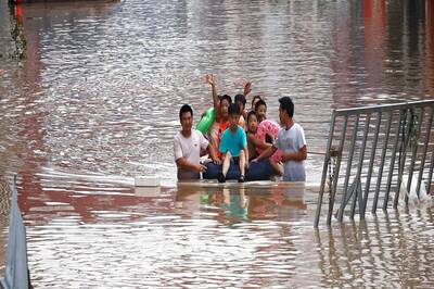 Villagers Flee Fresh Floods in Central China as Typhoon Threatens to Bring More Misery