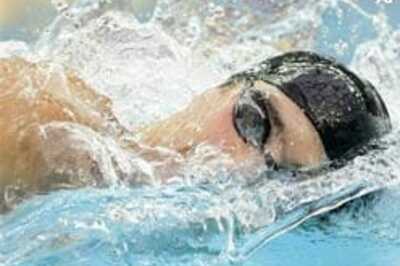 Phelps breaks 200m free world record for third gold