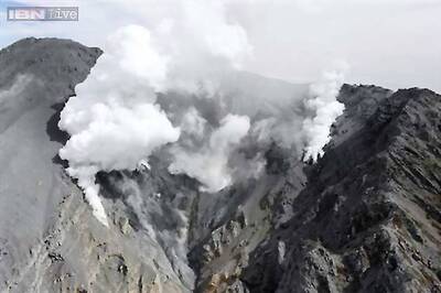 Search for bodies on Japan volcano halted as typhoon looms
