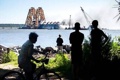 Damage Assessment Begins On Overturned Cargo Ship After Fire