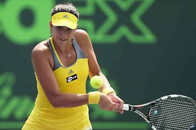 China's Li Na beats Garbine Muguruza to reach quarter-finals