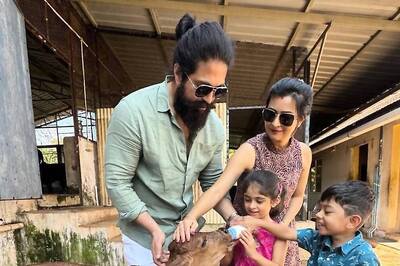 In Pics: South Star Yash's Daughter Ayra Feeds Milk To A Calf At His Farm