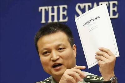 China to extend military reach, build lighthouses in disputed waters