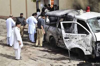 Taliban suicide bomber kills 30 at a policeman's funeral in Pakistan