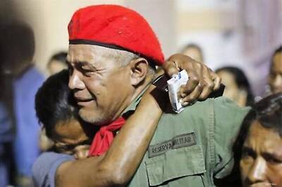 Mourning Venezuelans parade Chavez's coffin, prepare for vote