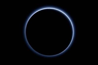 Blue sky and red ice at Pluto, NASA spacecraft discovers