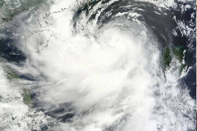 Three Dead, 77,000 Flee as Storm Pounds Philippines