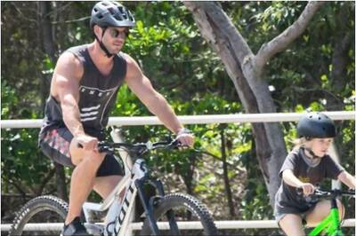 Chris Hemsworth Enjoys Biking with His Kids, See Pics
