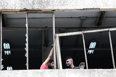 Hardened Lebanese merchants battered by Beirut blast
