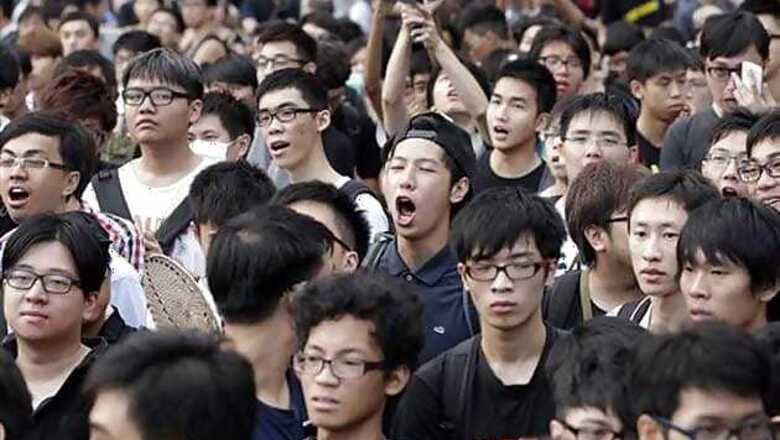 Protesters heckle Hong Kong leader in flag-raising ceremony on China's National Day