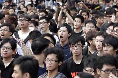 Protesters heckle Hong Kong leader in flag-raising ceremony on China's National Day