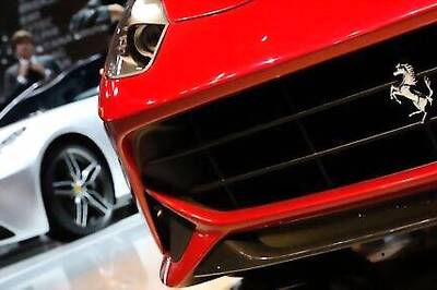 Luxury carmaker Ferrari trims forecasts after second-quarter profit falls