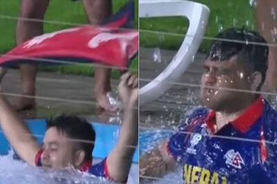 WATCH: Nepali Fan Jumps in the Pool to Celebrate Wicket Taken by Captain Rohit Paudel
